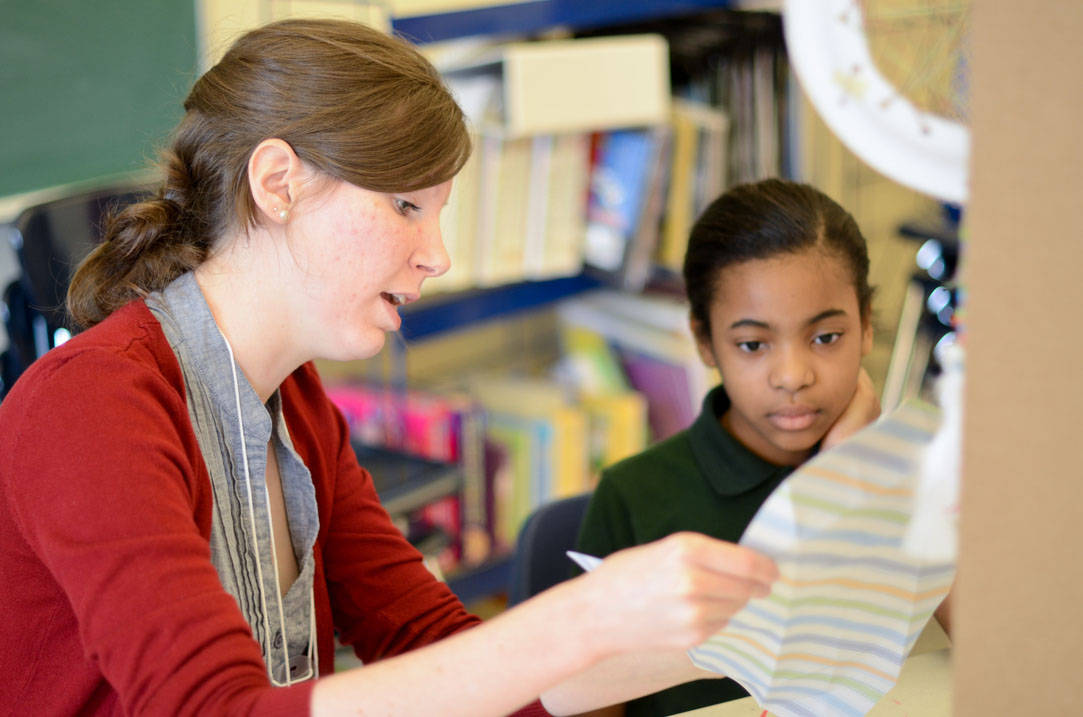 Student works with client on art project