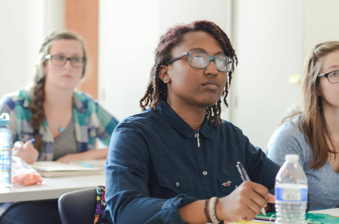 Student takes notes during class