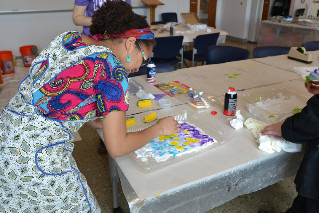 Art therapy degree student painting in studio