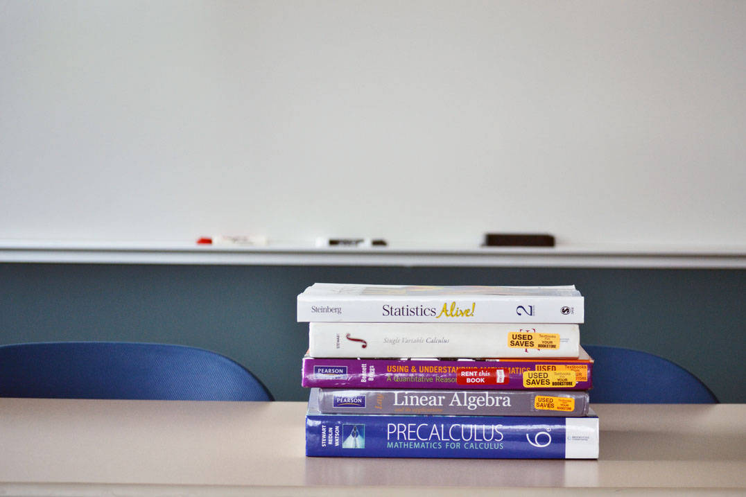 Stack of math textbooks at Ursuline