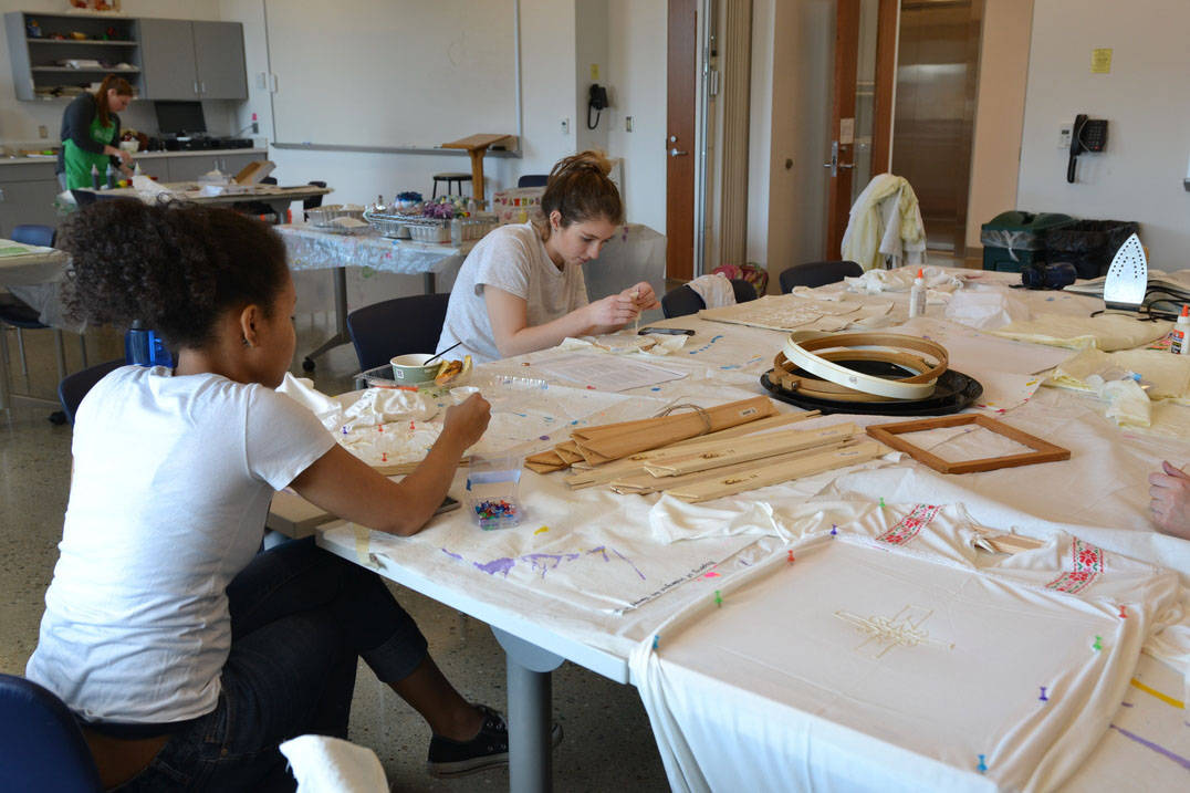 Ursuline art therapy program students creating textile designs in studio