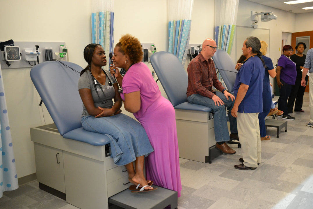 Master of Science in Nursing students practice techniques in nursing lab