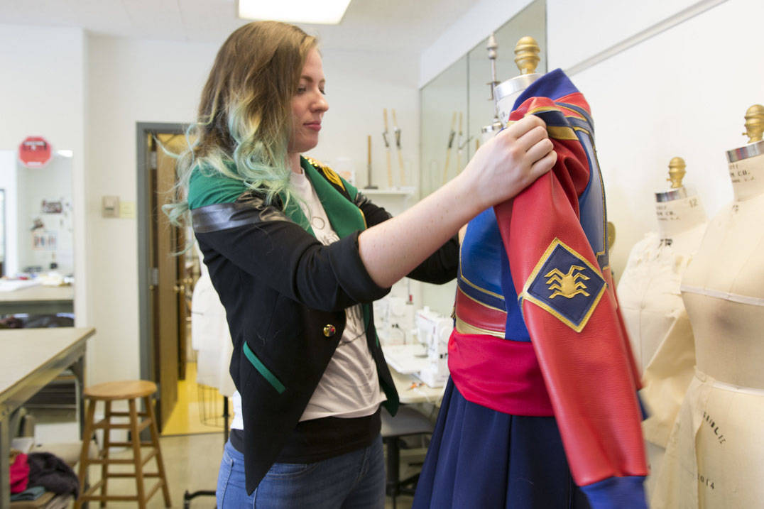 Fashion design student working on custom leather costume