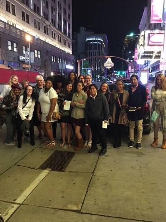 Students pose at Cleveland sign near the Rock and Roll Hall of Fame