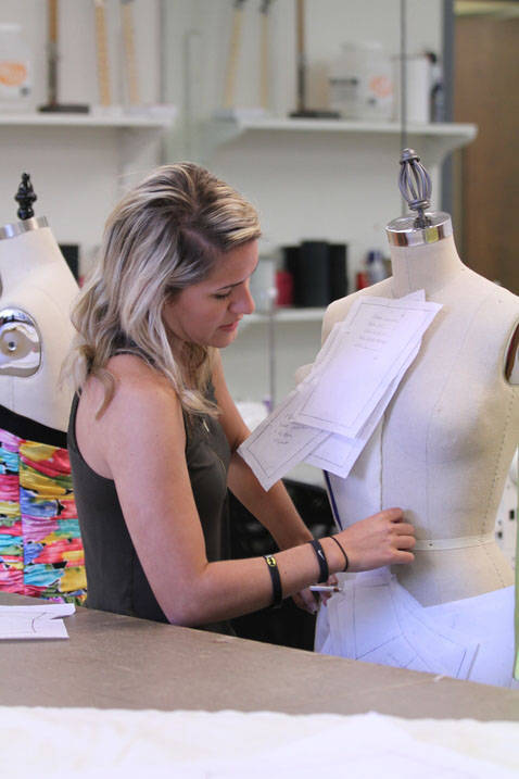 Fashion design student working on design