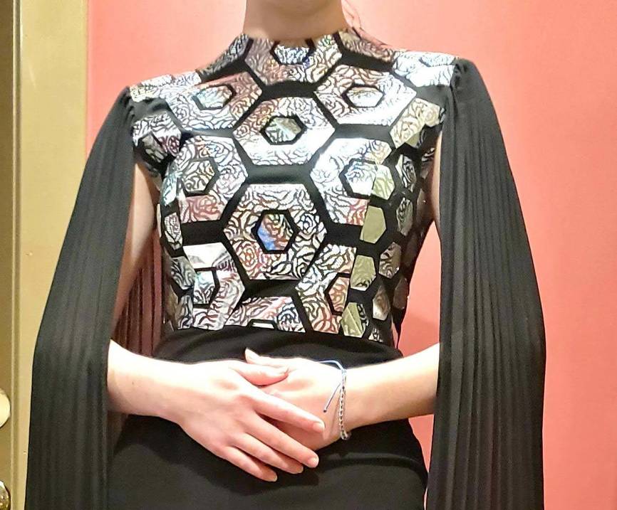 Student wears garment she made