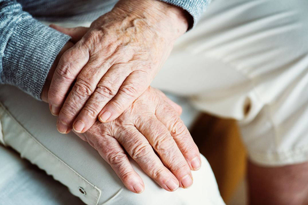 Senior patient's hands at appointment with adult gerontology acute care nurse practitioner in Ohio