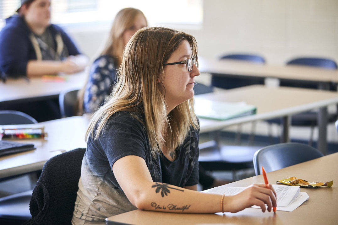 BSW program student listens to professor in class
