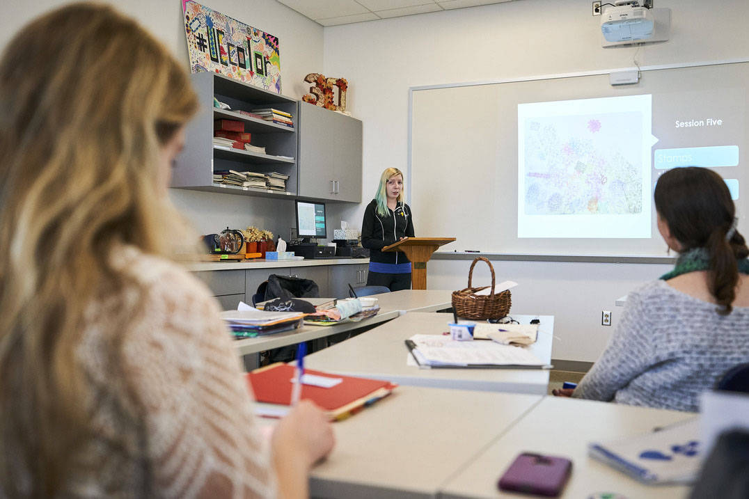 Art therapy program student presenting in classroom
