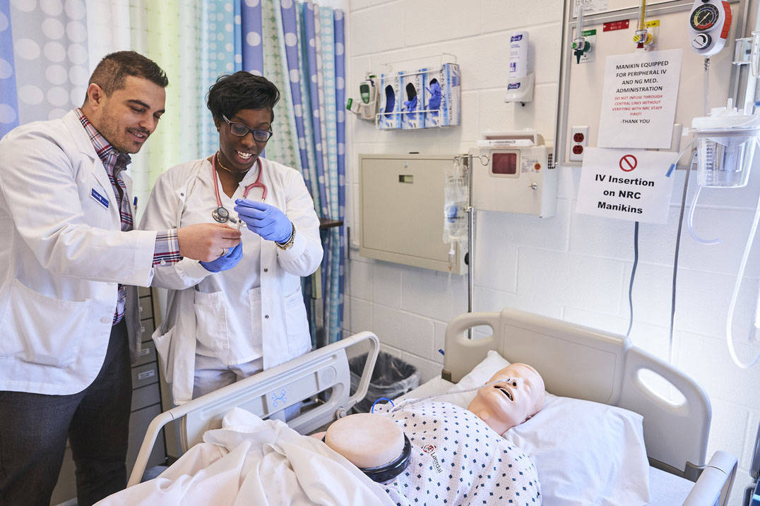 Ohio nursing school professor and student work in nursing lab