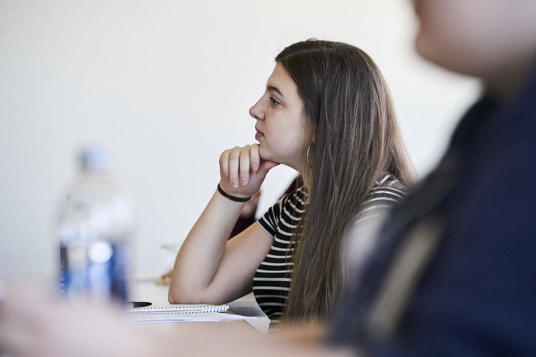 Student listens to professor