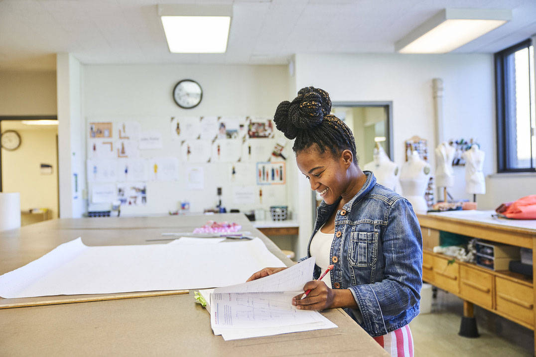 Fashion design degree student working on drafting
