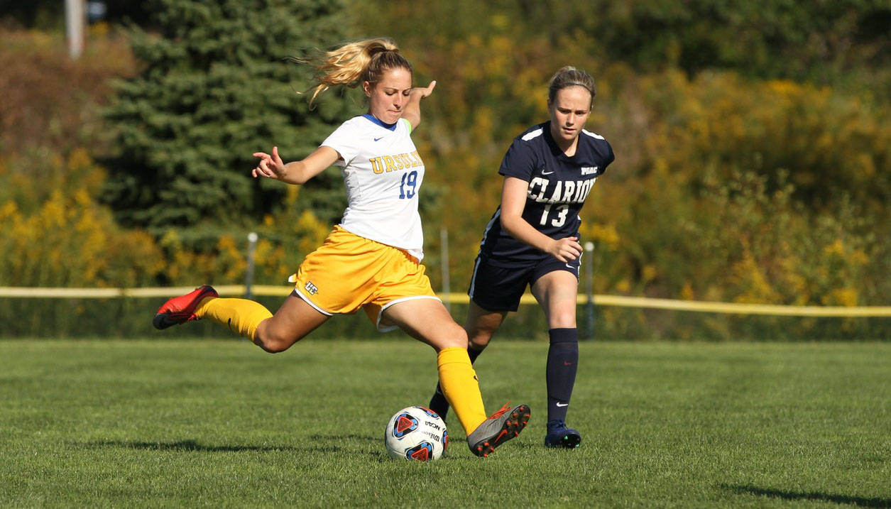 Ursuline College soccer player kicking