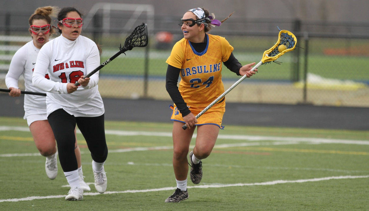 Ursuline Arrows Lacrosse player prepares for a pass