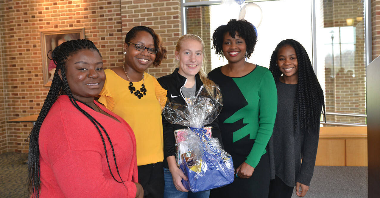 Tiffany Tarpley greets Ursuline students