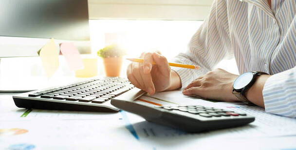 Image of Professional Bookkeeper with a calculator