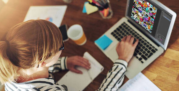 Image of Graphic Designer working on laptop