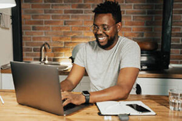Humanities student on laptop at home