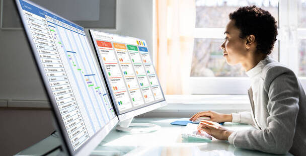 Image of Project Manager working on a laptop