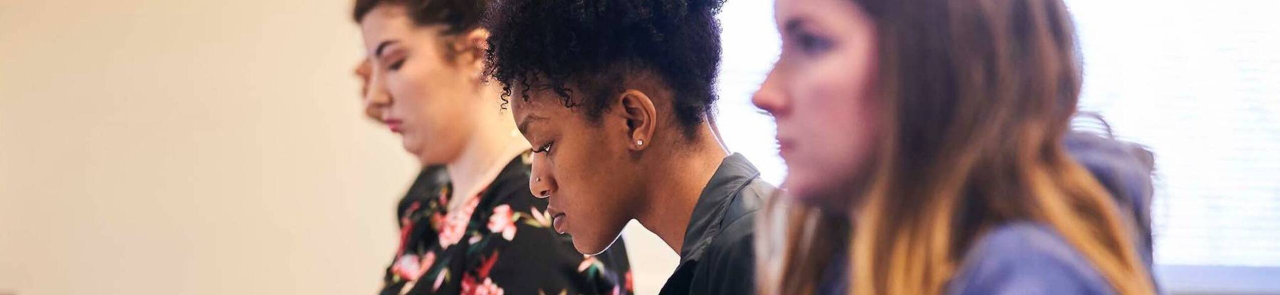 Ursuline college student looking at computer screen4
