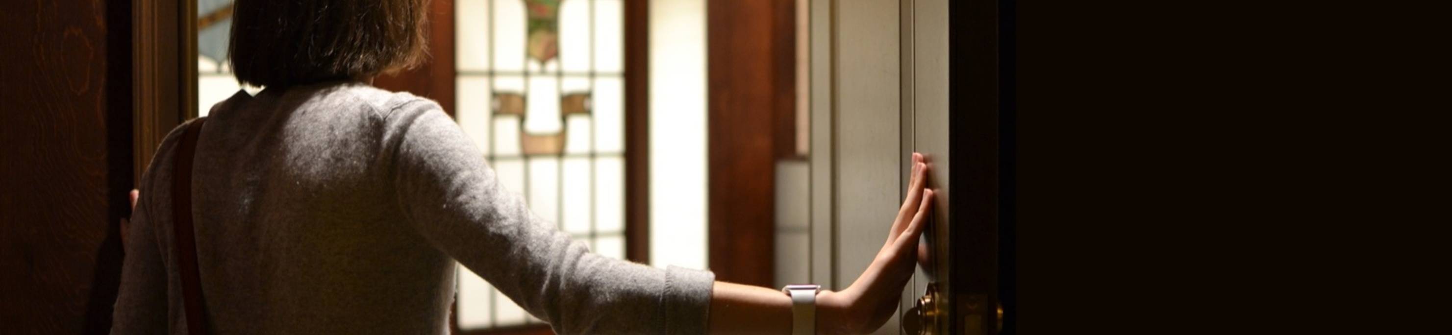 Ursuline college students woman opening door
