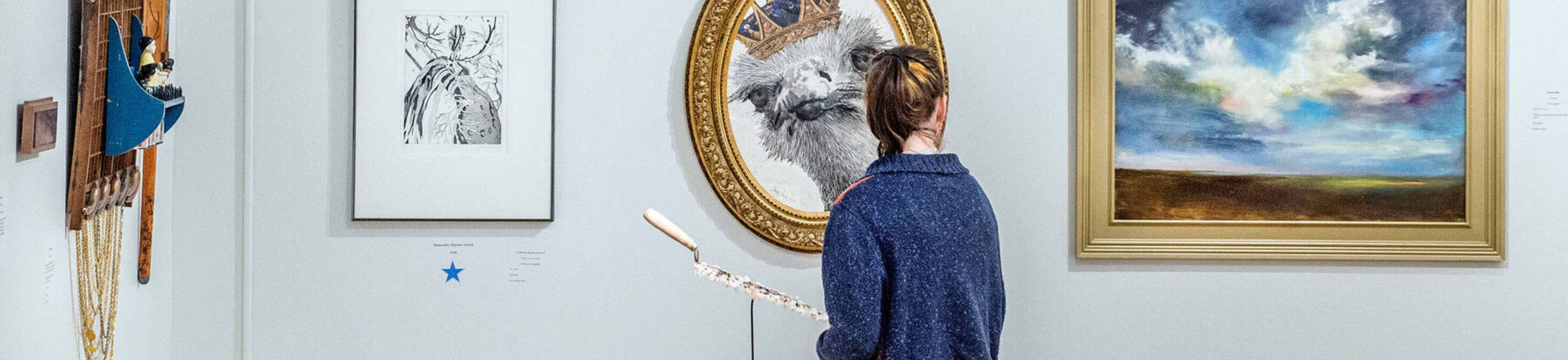 Image of guest viewing artwork at the Wasmer Gallery